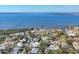 Scenic aerial view of a coastal neighborhood with stunning waterfront views, lush greenery, and beautiful homes at 8012 18Th W Ave, Bradenton, FL 34209