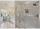 Modern bathroom with a marble walk-in shower, dual sinks, and tile floors at 8012 18Th W Ave, Bradenton, FL 34209