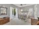Bright bedroom featuring a metal frame bed, neutral color walls, and french doors to the outdoor area at 8012 18Th W Ave, Bradenton, FL 34209