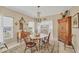 Cozy dining room with classic wooden furniture, a beautiful chandelier, and an inviting atmosphere for meals at 8012 18Th W Ave, Bradenton, FL 34209
