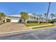Inviting single-Gathering home with a brick driveway, a covered porch, and well-maintained front yard at 8012 18Th W Ave, Bradenton, FL 34209