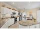 Bright kitchen featuring white cabinets, stainless steel appliances, and granite countertops at 8012 18Th W Ave, Bradenton, FL 34209