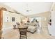 Bright living room with high ceilings, neutral tones, and a cozy seating area with stylish decor at 8012 18Th W Ave, Bradenton, FL 34209