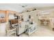 Open-concept living room with neutral decor, comfortable seating, and seamless flow to the dining and kitchen areas at 8012 18Th W Ave, Bradenton, FL 34209