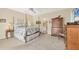 Spacious main bedroom with a four-poster bed and dresser at 8012 18Th W Ave, Bradenton, FL 34209