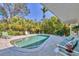 Inviting pool area with lush landscaping, lounge chairs, and a tranquil atmosphere at 8012 18Th W Ave, Bradenton, FL 34209
