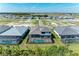 New construction home features a private screened pool and green landscaping at 8046 Anthirium Loop, Sarasota, FL 34240