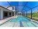 The screened-in pool and patio offer luxurious outdoor living at 8046 Anthirium Loop, Sarasota, FL 34240