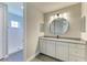 Bathroom featuring granite countertops, modern fixtures, and a tiled shower at 8046 Anthirium Loop, Sarasota, FL 34240