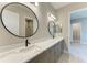 Bathroom features a large vanity with double sinks and black fixtures at 8046 Anthirium Loop, Sarasota, FL 34240
