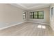 Bright room with recessed lighting, tile flooring, and a view from the large windows at 8046 Anthirium Loop, Sarasota, FL 34240