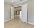 Neutral bedroom offers an open door and view into the rest of the home at 8046 Anthirium Loop, Sarasota, FL 34240