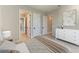 Bedroom with neutral tones, white trim, and views into the hallway and Primary closet at 8046 Anthirium Loop, Sarasota, FL 34240