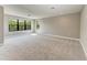 Spacious bedroom features large windows offering abundant natural light and serene views at 8046 Anthirium Loop, Sarasota, FL 34240