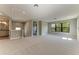 Bright bedroom with an ensuite bathroom, large windows, and plush carpet at 8046 Anthirium Loop, Sarasota, FL 34240