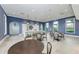 Community kitchen with tables, chairs, and a large kitchen island at 8046 Anthirium Loop, Sarasota, FL 34240