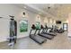 Bright gym featuring treadmills, elliptical machines, and weightlifting stations with multiple windows at 8046 Anthirium Loop, Sarasota, FL 34240
