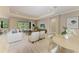 Comfortable living room featuring tile floors, modern furnishings, and sliding doors to the pool area at 8046 Anthirium Loop, Sarasota, FL 34240