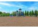A fun community playground with slides and climbing equipment sits on a wood chip surface at 8046 Anthirium Loop, Sarasota, FL 34240