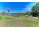 The home features a serene pond at 8046 Anthirium Loop, Sarasota, FL 34240