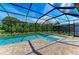 A screened-in pool and patio provides ample space for outdoor enjoyment at 8046 Anthirium Loop, Sarasota, FL 34240
