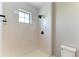 Modern shower with sleek tile, stylish fixtures, and ample natural light at 8046 Anthirium Loop, Sarasota, FL 34240