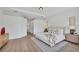 Spacious bedroom with wood floors, neutral decor, and ample natural light at 8330 Abingdon Ct, University Park, FL 34201