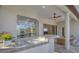 Outdoor kitchen with built-in grill under a covered patio at 8330 Abingdon Ct, University Park, FL 34201