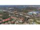 Aerial view of a home near retail and a lake at 8420 Sailing Loop, Lakewood Ranch, FL 34202