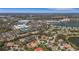 Charming neighborhood aerial view showcasing tree-lined streets near shopping and a tranquil lake at 8420 Sailing Loop, Lakewood Ranch, FL 34202