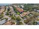 Beautiful aerial view featuring a home with a screened-in pool and landscaped surroundings at 8420 Sailing Loop, Lakewood Ranch, FL 34202