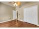 Bedroom featuring hardwood floors, ceiling fan, and closet at 8420 Sailing Loop, Lakewood Ranch, FL 34202