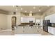 Kitchen with granite counters, white cabinets, stainless steel appliances, and mosaic tile backsplash at 8420 Sailing Loop, Lakewood Ranch, FL 34202