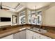 Granite countertops and stainless steel appliances accent this well lit kitchen with an undermount sink at 8420 Sailing Loop, Lakewood Ranch, FL 34202