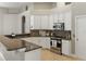 Modern kitchen with granite countertops, stainless steel appliances, and custom cabinetry at 8420 Sailing Loop, Lakewood Ranch, FL 34202