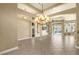 Bright living room with tile flooring and views of the pool through sliding glass doors at 8420 Sailing Loop, Lakewood Ranch, FL 34202