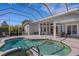 Screened-in pool and patio area offers a relaxing outdoor living space at 8420 Sailing Loop, Lakewood Ranch, FL 34202
