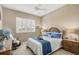 Relaxing bedroom boasts natural light, plantation shutters, and comfortable furnishings at 854 Dahoon Cir, Venice, FL 34293