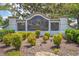 Elegant community sign for 'The Lakes of Jacaranda', surrounded by lush greenery and landscaping at 854 Dahoon Cir, Venice, FL 34293