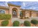 Stunning home featuring manicured landscaping, a paver walkway and a stately double door entry at 854 Dahoon Cir, Venice, FL 34293