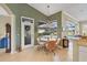 Bright kitchen and dining nook with views of the pool area, creating a delightful space for casual meals at 854 Dahoon Cir, Venice, FL 34293
