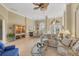 Bright and airy living room with tile flooring, and a ceiling fan at 854 Dahoon Cir, Venice, FL 34293