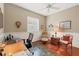 Office space with wainscoting, hardwood floors, plantation shutters, and plenty of natural light at 854 Dahoon Cir, Venice, FL 34293