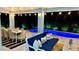 Evening view of covered outdoor living space and beautiful pool with spa at 9158 16Th Avenue Nw Cir, Bradenton, FL 34209