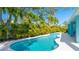 Beautiful backyard pool and hot tub surrounded by lush tropical landscaping, perfect for relaxation and entertaining at 9158 16Th Avenue Nw Cir, Bradenton, FL 34209