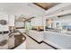 Well-lit kitchen featuring sleek countertops, white cabinetry, and modern appliances at 97 Sunset Dr # 202, Sarasota, FL 34236