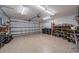 Garage interior showcases clean epoxy flooring, and ample space for storage and parking at 12151 Amica Loop, Venice, FL 34293