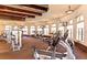 Gym featuring modern exercise machines, overhead lighting, and floor to ceiling windows at 12151 Amica Loop, Venice, FL 34293