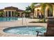 Relaxing hot tub adjacent to a large pool, perfect for unwinding at 12151 Amica Loop, Venice, FL 34293