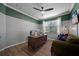 Bright office space with a large window, comfortable seating, and modern decor for remote work at 12151 Amica Loop, Venice, FL 34293